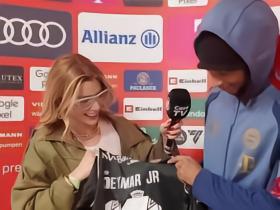 内马尔向奥利塞赠送签名球衣，并托记者让奥利塞送回一件签名球衣